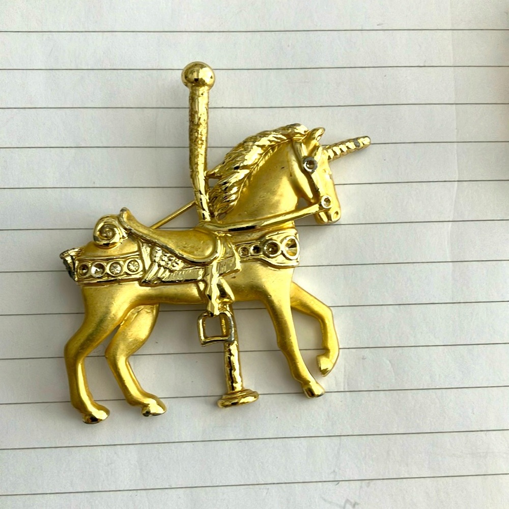 Gold unicorn merry go round pin